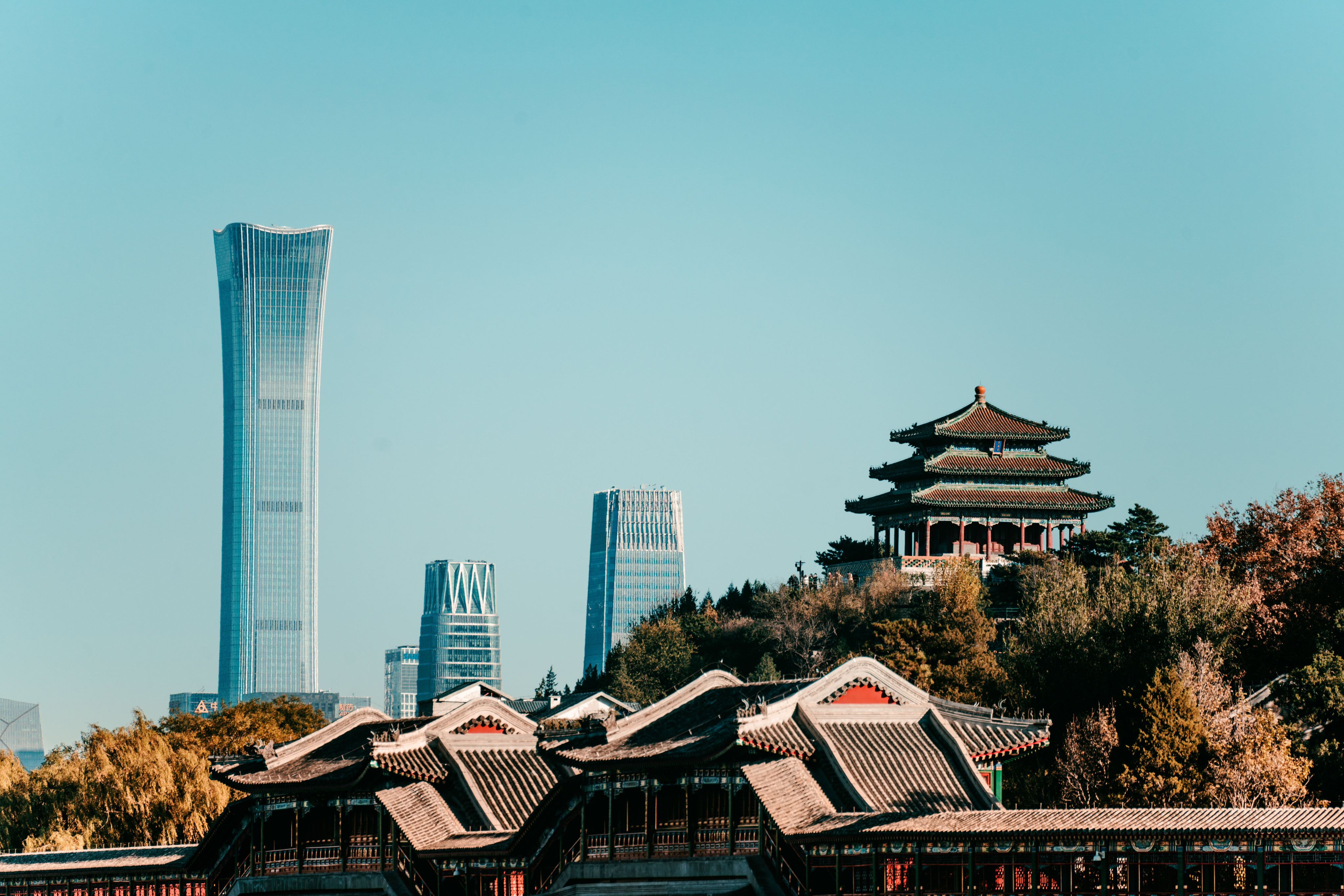 Traditional Chinese architecture beside a modern city